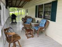 Great seating area on the side porch directly off of the mud room from the side door