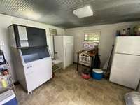 Mud room right off of the side porch. No entering the house with those muddy boots. The dirt stops here.