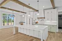 An additional view of the kitchen area. These cabinets were custom handmade and have so many detailed finishes.