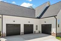 View of the side load 3 - Car Garage! This garage has so much space including a bump out designated for a refrigerator/ freezer that will not impede upon your parking area.