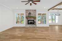 Come make this spacious living room your own & cozy up beside the beautiful brick fireplace with a book or a movie.