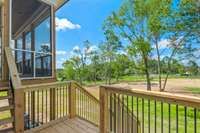 View from the open portion of the deck. Imagine grilling on a sunny day with this peaceful setting around you!