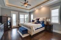 Large Master suite overlooking golf course. Notice the trey ceiling with wonderful mood lighting. Hardwood floors. Private porch off Master.