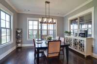 Large dining area. Notice all the windows overlooking the golf course.