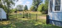 Nice fence from home to shed. Back yard is completely fenced in and great for pets.