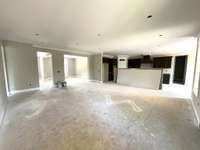 View from the Family Room to the Foyer/Formal Dining/Flex space! The Primary Suite is to the left and the Kitchen/Breakfast/Scullery is to the right.