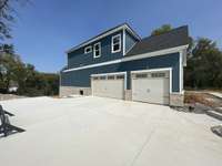 Don’t let the photo fo you… THIS IS A 3-CAR Garage! The left door is the Double:)