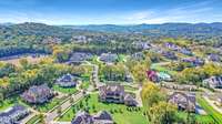 Gorgeous aerial view of the Witherspoon subdivision and the subdivision club house (red roof building) and community pool.