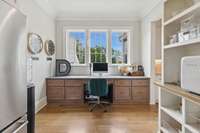 Desk/office in working pantry with view of the outdoor pool and back yard