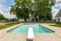 As you cannonball into the pool, feel the stress of the day wash away in the soothing waters, embraced by the natural privacy provided by the surrounding trees.