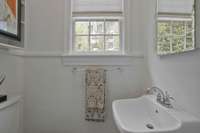 Main Level Half Bath off 3rd Bedroom/Office.