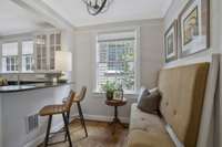 Breakfast Area attached to the kitchen with a new Light fixture, Built-in Banquette with additional storage.