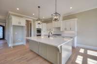 Quartz countertops set this kitchen off! Don't miss the extra storage in this island.