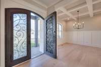 The glass inserts on these beautiful doors open to inner screens so you can enjoy fresh air on beautiful days.