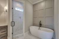 Welcome to your oversized rain shower and feature wall adorning the soaking tub!