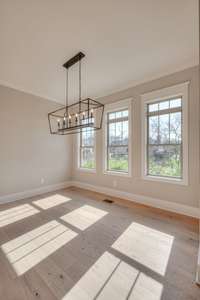 Don't you just love how the light floods in the dining area? And wow - transom windows too!