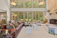 The Great Room is centered on the awe inspiring natural stacked stone wood burning fireplace, with whole slab stone hearth and mantle.