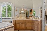 Double Vanities and Light Marble Countertops.