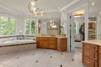 Primary Bath is Breathtaking! Tile Floor with marble inlays.