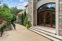 Magnificently Custom Built, One Owner Home on Secluded Wooded Acres Embedded into the Landscape with Nature Providing the Ultimate Serene Privacy.