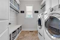 Fabulous laundry room with granite utility sink.