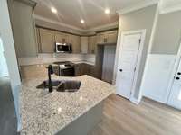 Granite counter tops and pantry in kitchen