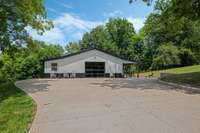 Party barn, complete with stage & wired for sound, plus guest quarters, full kitchen and full bath.