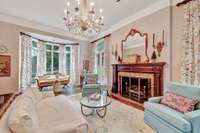 Chic oversized bay window overlooking front entry courtyard.