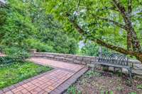 Charming sidewalks, stone ledges and landscaping surround the property.