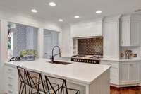 Gorgeous remodeled kitchen completed in 2024.  Center island with deep soaking sink.  Quartz countertops.