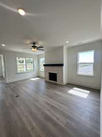 Living Room with Upgraded Gas Fireplace and Flooring