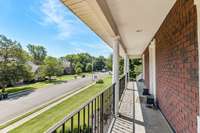 Second story balcony overlooking front yard.