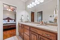 This jack and jill bath is perfectly situated between the two secondary bedrooms on the main floor. Custom vanity features pull out steps in front of each sink.