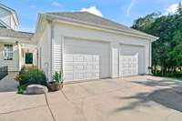 Two car detached garage is just a few steps off of the kitchen entry and connected via a covered walk-way.