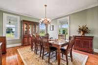 Seller uses this well lit room as a dining room.