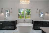 Master bath suite looks out over the private backyard