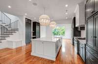 Oversized kitchen island is serves as a hub of activity for cooking, snacks, and homework