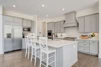 Beautiful cabinets, tile backsplash and quartz countertops