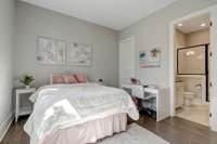 Bedroom 2 on the main floor with ensuite bathroom and walk-in closet