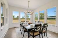 Windows on 3 sides of this beautiful dining room