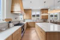 Kitchen - Custom cabinets and range hood