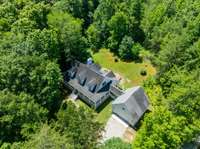 Welcome to 2010 Cliff View Drive S. This is a drone photo reflecting the woods and privacy....such a lovely 1.4 acre property.