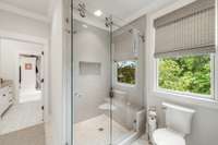 En suite upstairs full bathroom with walk in shower