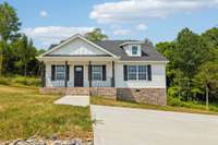 PHOTO OF SIMILAR HOME BY SAME BUILDER IN SAME DEVELOPMENT.  Lot 9 will be level on slab - no crawl space.