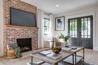 French doors open to the front porch from Living Room