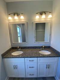 Double vanity with granite countertops