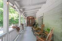 One of two main entrances to the home, a favorite spot for all on this ideal rocking chair porch