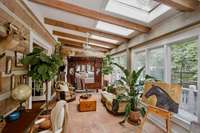 Sunroom with double doors to the Primary Bedroom Suite