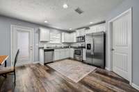 Alternate view of this large kitchen, walk in pantry within the kitchen.