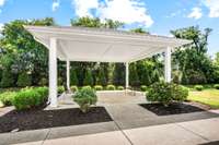 Community pavilion with benches for your outdoor green space.